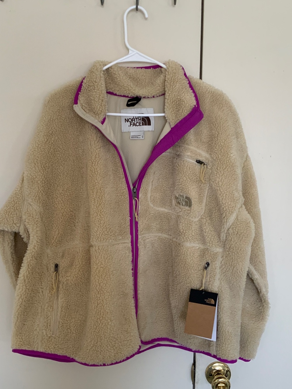 The North Face Women’s Cream Sherpa Fleece Jacket with Purple Trim